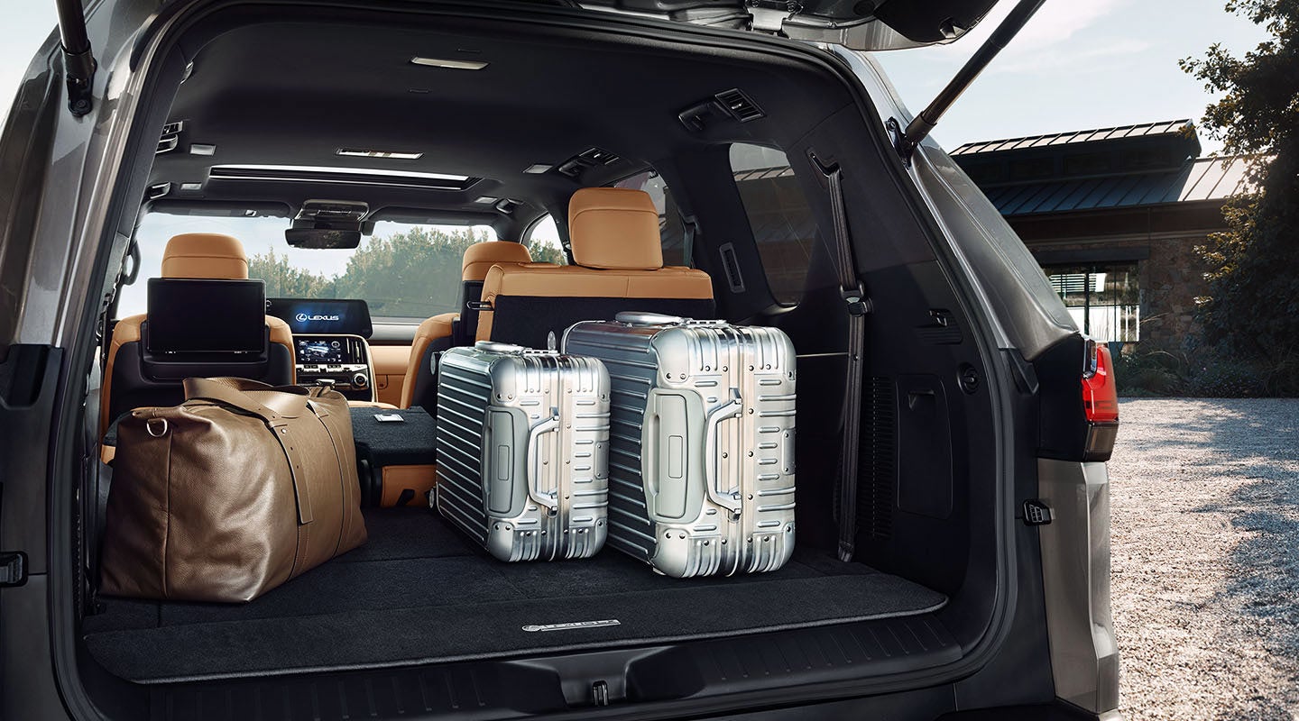 Detail shot of the open trunk of the 2022 Lexus LX 600 with luggage. | Lexus of Kingsport in Kingsport TN